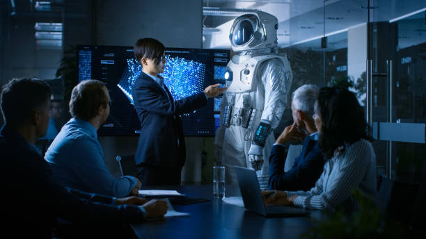 istock In the Conference Room Chief Engineer Presents Next Generation Space Suit to a Board of Directors. Completely Original Design with Integrated AI and Neural Network Systems. New Level of Space Travel. 921054658