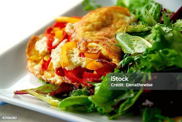 Close Up Of Delicious Omelets Served With Fresh Greens Stock Photo - Download Image Now