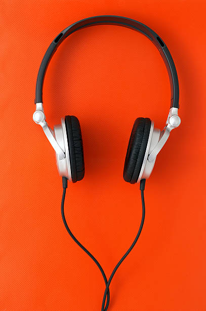 istock DJ Headphones on Orange Backrgound 92107845