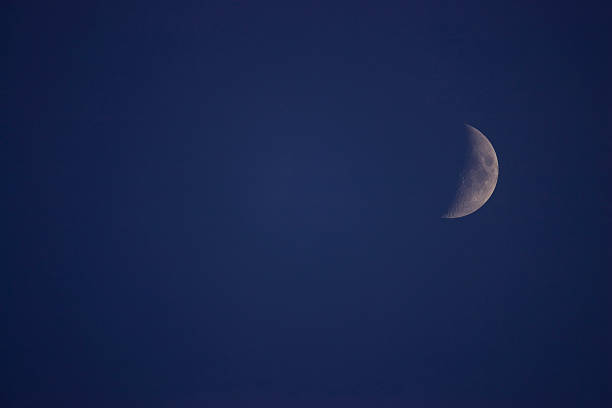 The Moon The Moon on blue background cusp stock pictures, royalty-free photos & images