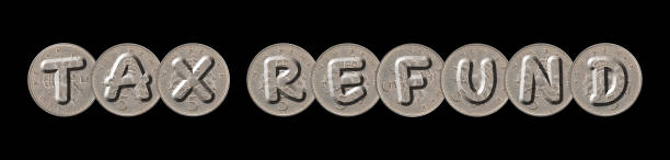 istock TAX REFUND – Coins on black background 921086304