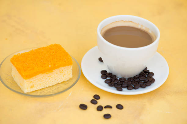 istock A cup of coffee and golden threads cake 921089128