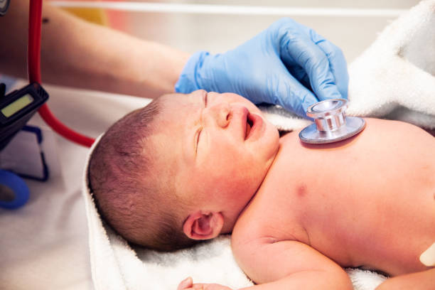 istock Newborn baby checked with a stethoscope 921092892