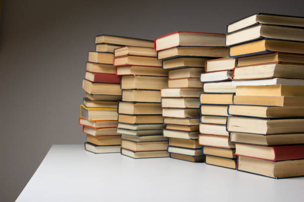 istock Stack of books background. many books piles. 921095440