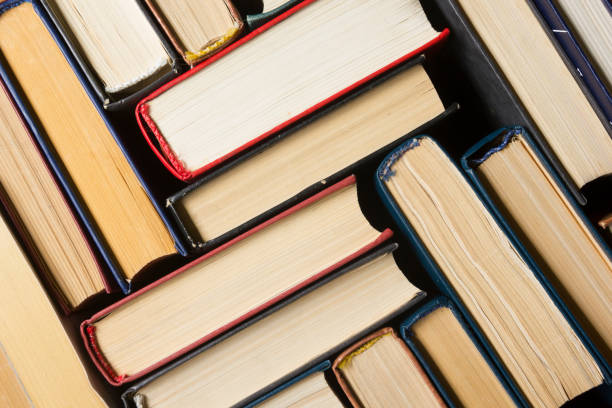 istock Stack of books background. many books piles. 921095524