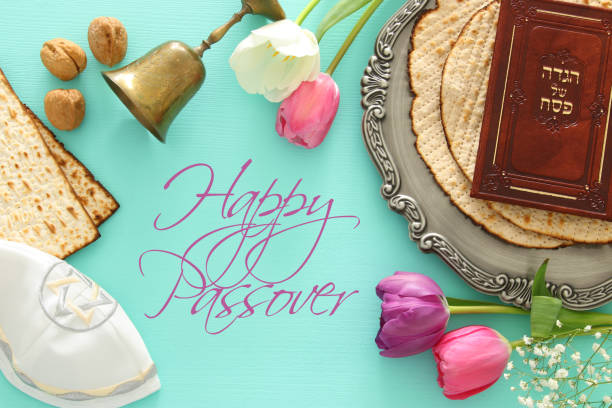 istock Pesah celebration concept (jewish Passover holiday). Traditional book with text in hebrew: Passover Haggadah (Passover Tale). 921095636