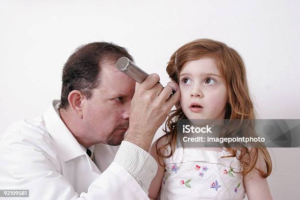Doctor Examining A Childs Ear Stock Photo - Download Image Now - Child, Clipping Path, Color Image