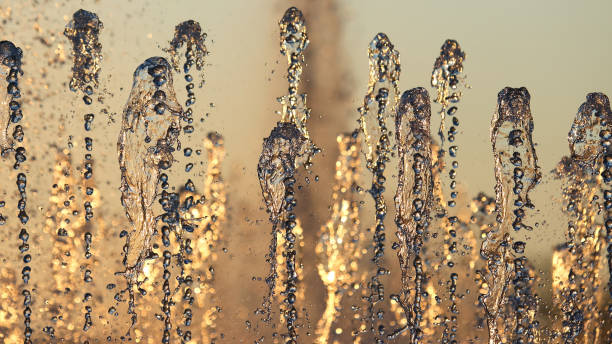 istock drops of the fountain in the setting sun 921095988
