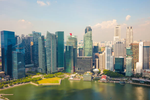 istock Modern Skyscrapers By River In Singapore 921096074