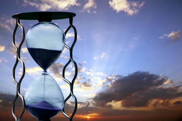 istock hourglass on the background of sunset 921109464