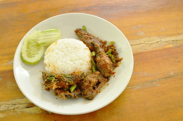 istock spicy stir fried crispy catfish curry with rice 921119328