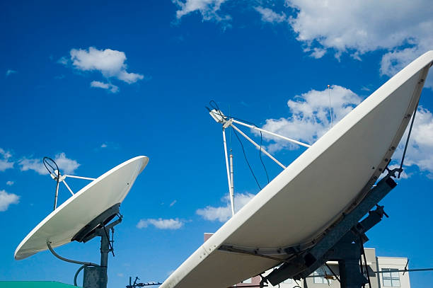 istock Satellite dishes pointing up to space 92112374