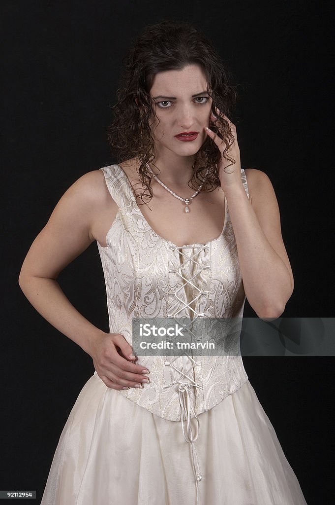 Unhappy A young woman with a sad look on her face. Adult Stock Photo
