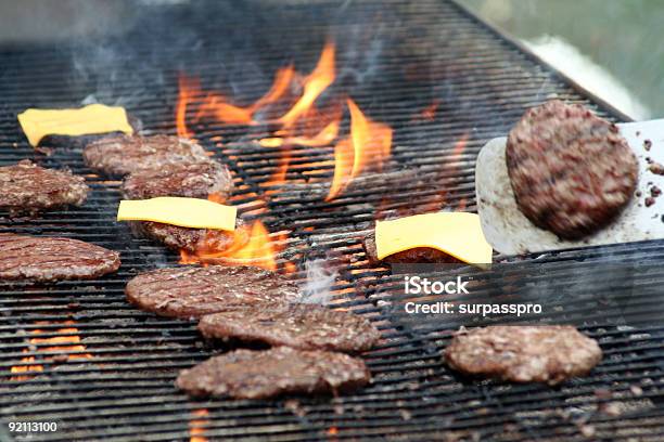 Burgers On The Grill Stock Photo - Download Image Now - Back, Barbecue - Meal, Barbecue Grill