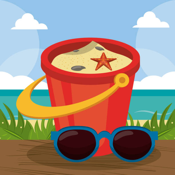 istock summer holidays - sunglasses, bucket, shovel sand on a sunny day 921132664