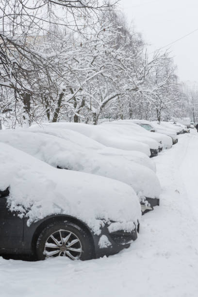 istock Parked cars covered with snow 921135160