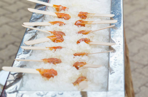 istock Hot maple syrup on a stick in the snow 921141304