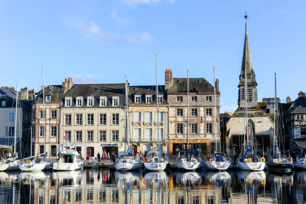 HONFLEUR, FRANCE - NOV 9, 2014: Yachts in the typical harbor of Honfleur  on Nov 9, 2014.