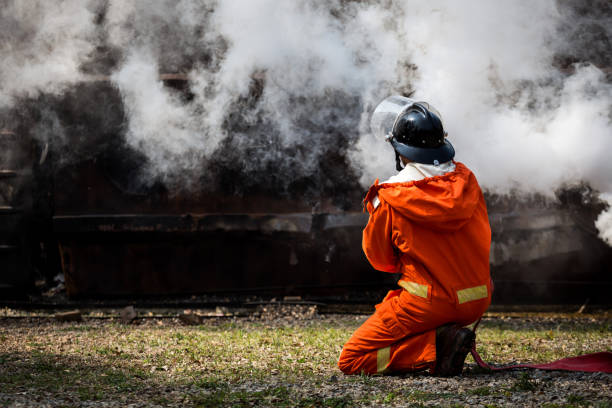 istock Firefighters training, Team practice to fighting with fire in emergency situation. Attack to the place after flame extinguish 921145694