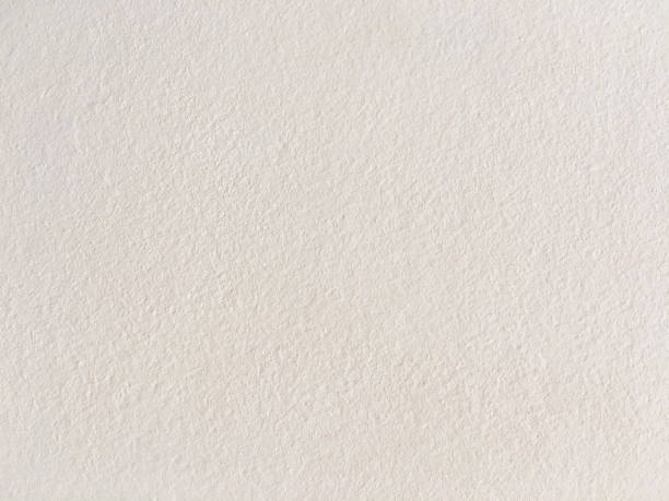 istock Grungy painted wall texture as background. Cracked concrete vintage wall background, old white painted wall. Background white painting. 921146170