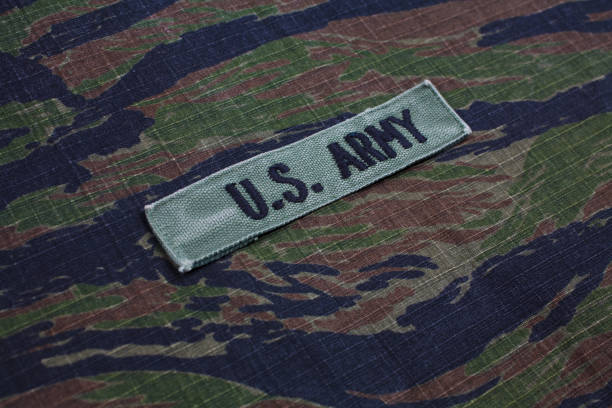 istock US ARMY branch tape on tiger stripe camouflage uniform 921146566