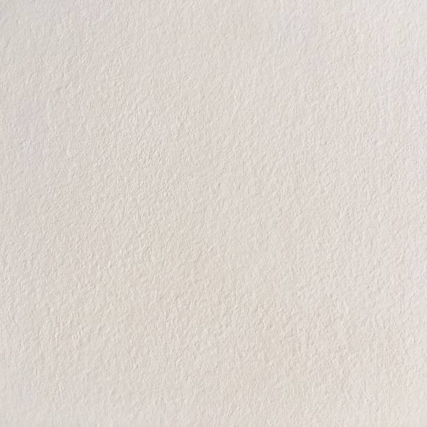 istock Grungy painted wall texture as background. Cracked concrete vintage wall background, old white painted wall. Background white painting. 921147310