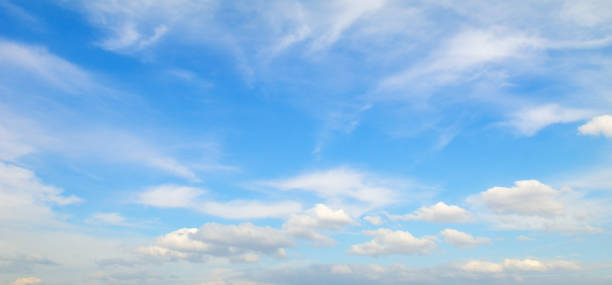 istock Light cumulus clouds in the blue sky 921147578