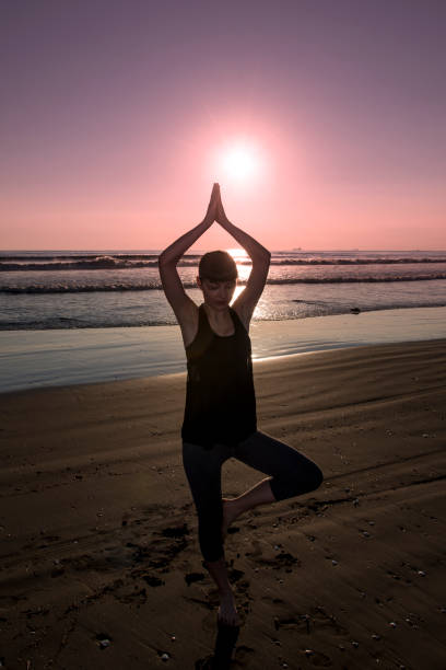istock Silhouette yoga practice at sunset 921153690