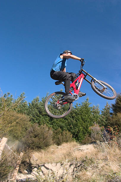istock jumping on mountainbike 92115452