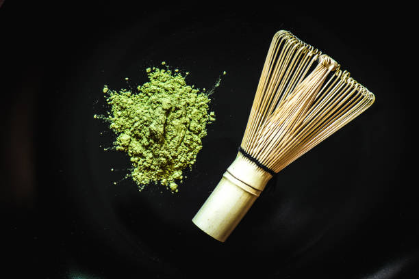 istock Matcha green tea on  black background 921157482