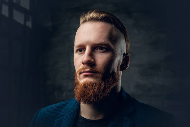 istock Redhead bearded hipster male dressed in a blue jacket. 921158732