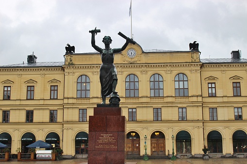 Karlstad, Sweden - July 29, 2015: Peace monument in front of the town hall on the Great Square. Erected in 1955 to commemorate the peaceful dissolution of the union between Sweden and Norway in 1905. Sweden, Scandinavia, North Europe.