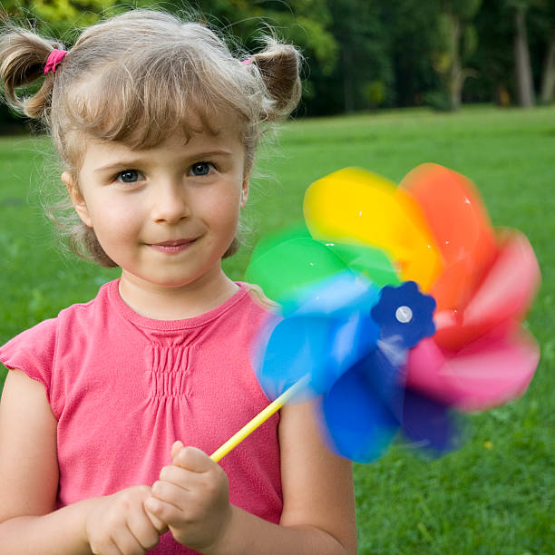 istock Cute girl with windmill 92118097