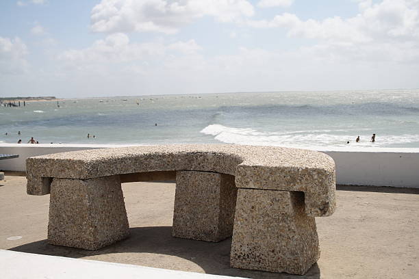 istock Stone Covered Bench near the Beach 92118264
