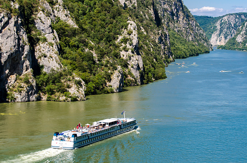 Cruise ship on river Danube in Djerdap gorge in Serbia. At 2016 118 cruise ships with more than 18.000 tourists visited Djerdap National park.