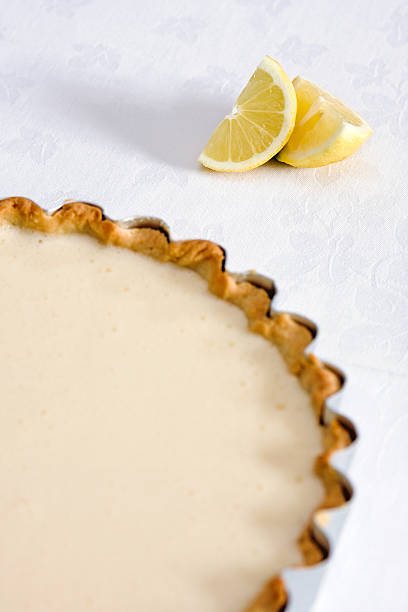 istock Lemon pastry tart on tablecloth with lemons 92118892