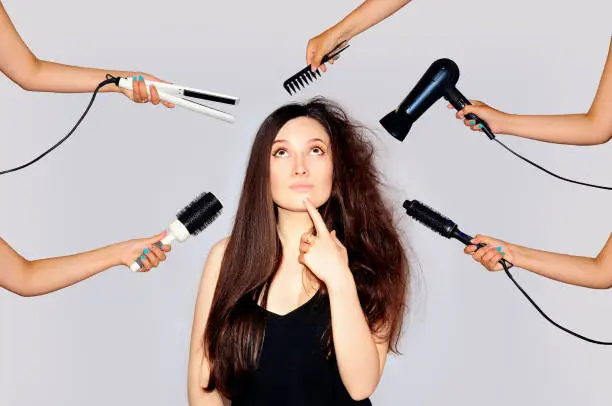 Young woman getting a beauty and hair style in the same time with hands making different works. Damaged hair long. 