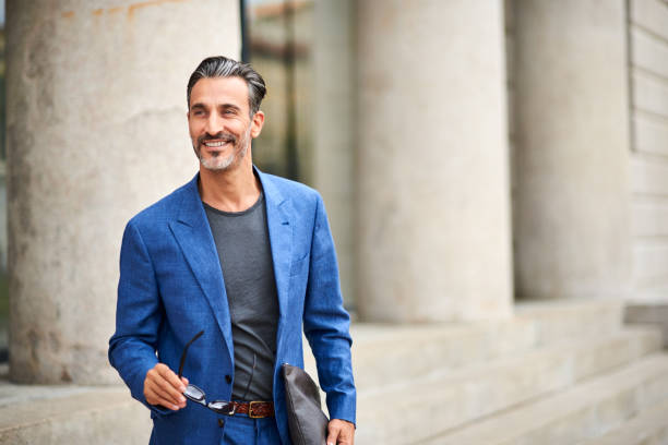 istock Portrait of a handsome smiling man 921198182