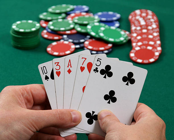 Bluffing at Poker  hand of cards stock pictures, royalty-free photos & images