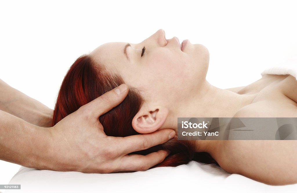 Massage therapy for a woman client woman getting a head and shoulder massage on white background Adult Stock Photo