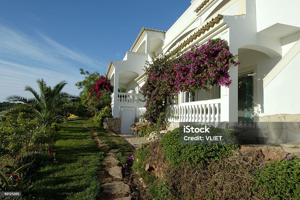 White holiday villa and garden in Portugal during summer  Portugal Stock Photo