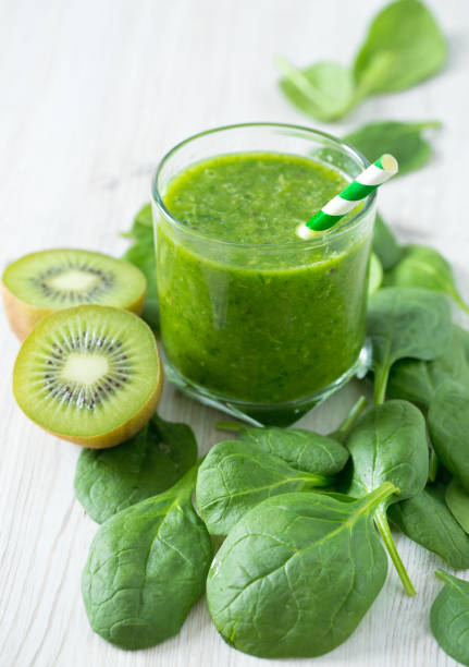 istock fresh green smoothie on wooden surface 921216096