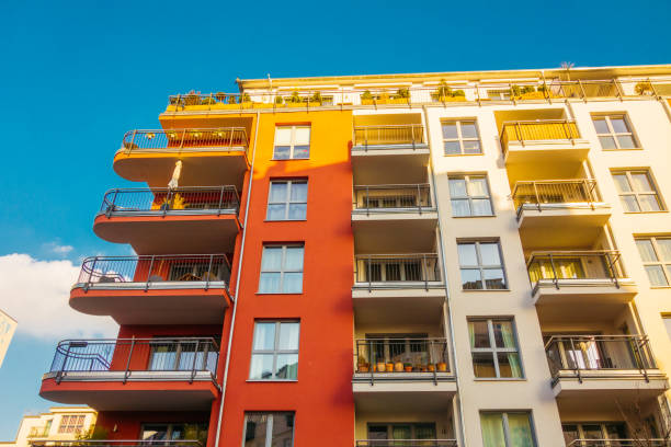 istock red and white facaded buildings in warm sunlight 921225014