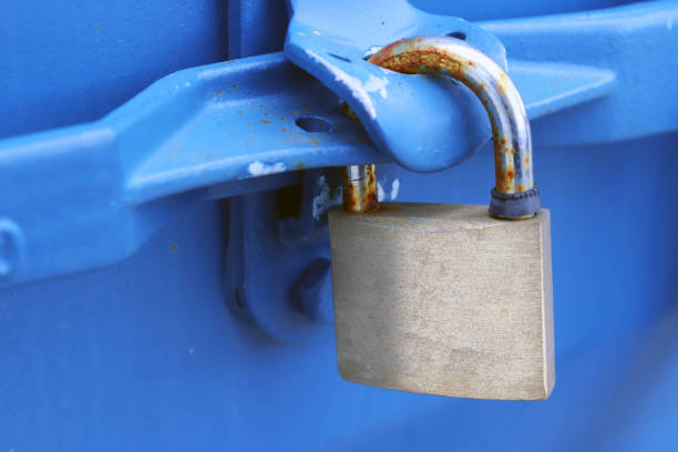 istock Gold Padlock on Blue Metal Background - Protection/Security Concept 921230430