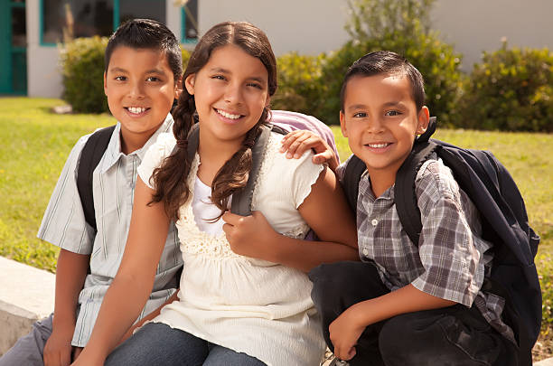Cute Brothers and Sister Ready for School  sibling stock pictures, royalty-free photos & images