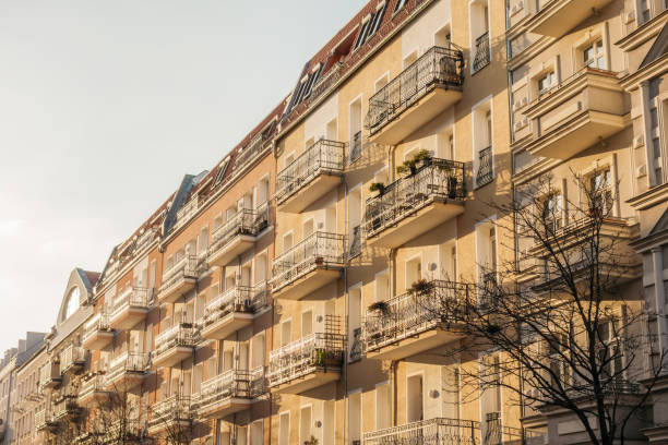 istock yellow beautiful apartment houses with white balcony 921231236
