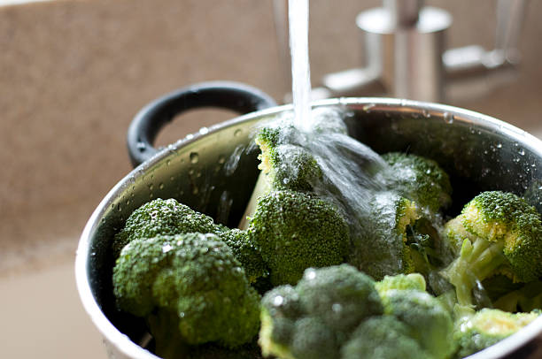 istock Pot of vegetables under running water 92123262