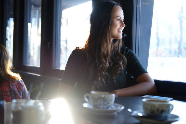 istock Brunette woman in a cafe. 921236404
