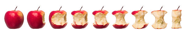 maçãs em andamento - apple missing bite fruit red - fotografias e filmes do acervo