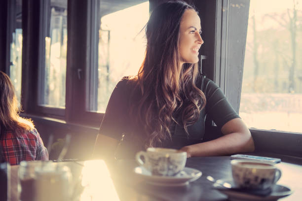 istock Brunette woman in a cafe. 921245514